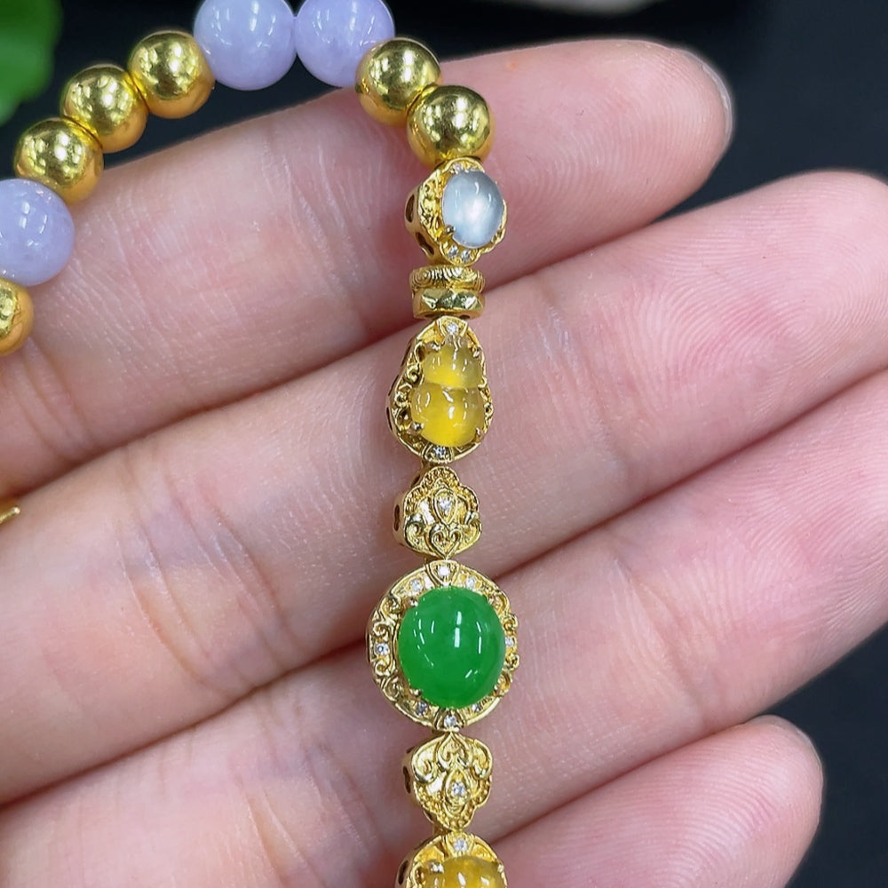 Jadeite bead bracelet with mixed gold components, featuring smooth green jade beads and gold accents, stylish jewelry accessory