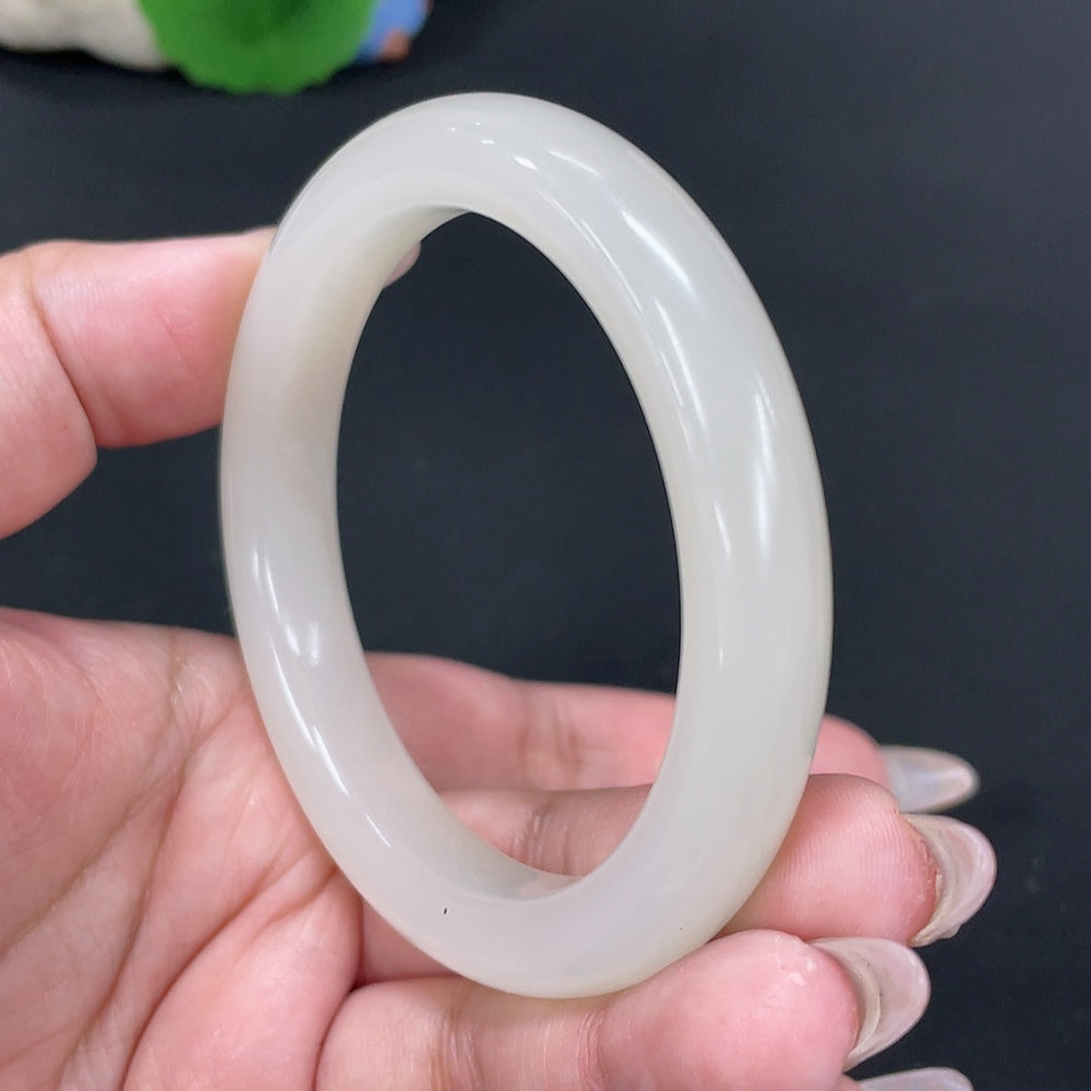 Huiliu certified Hetian Jade round bracelet featuring smooth, polished jade beads on a delicate string.