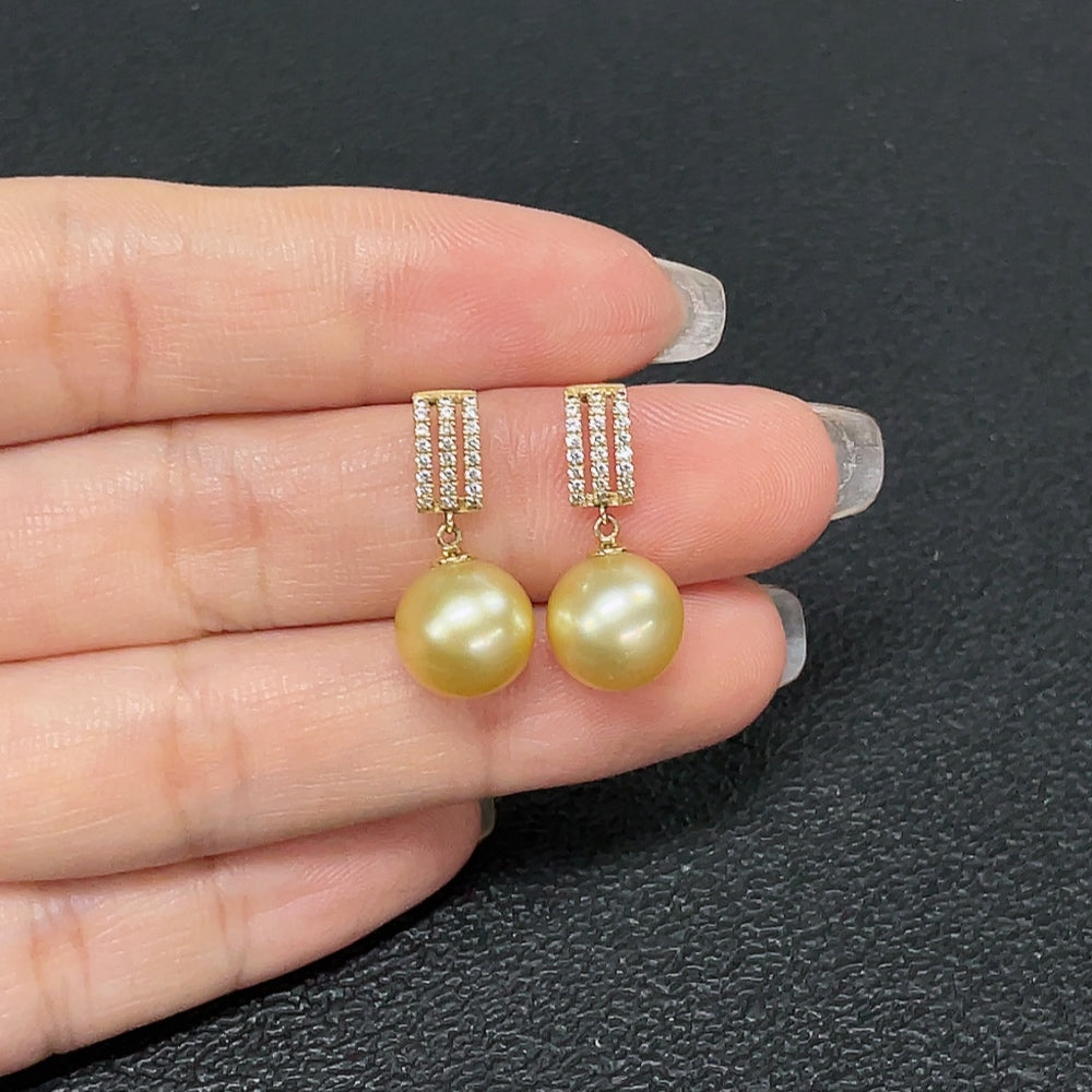HKHQ seawater pearl earrings with 9.4mm pearls set in 14K gold, weighing about 3.43g, showcasing elegant natural pearl jewelry.