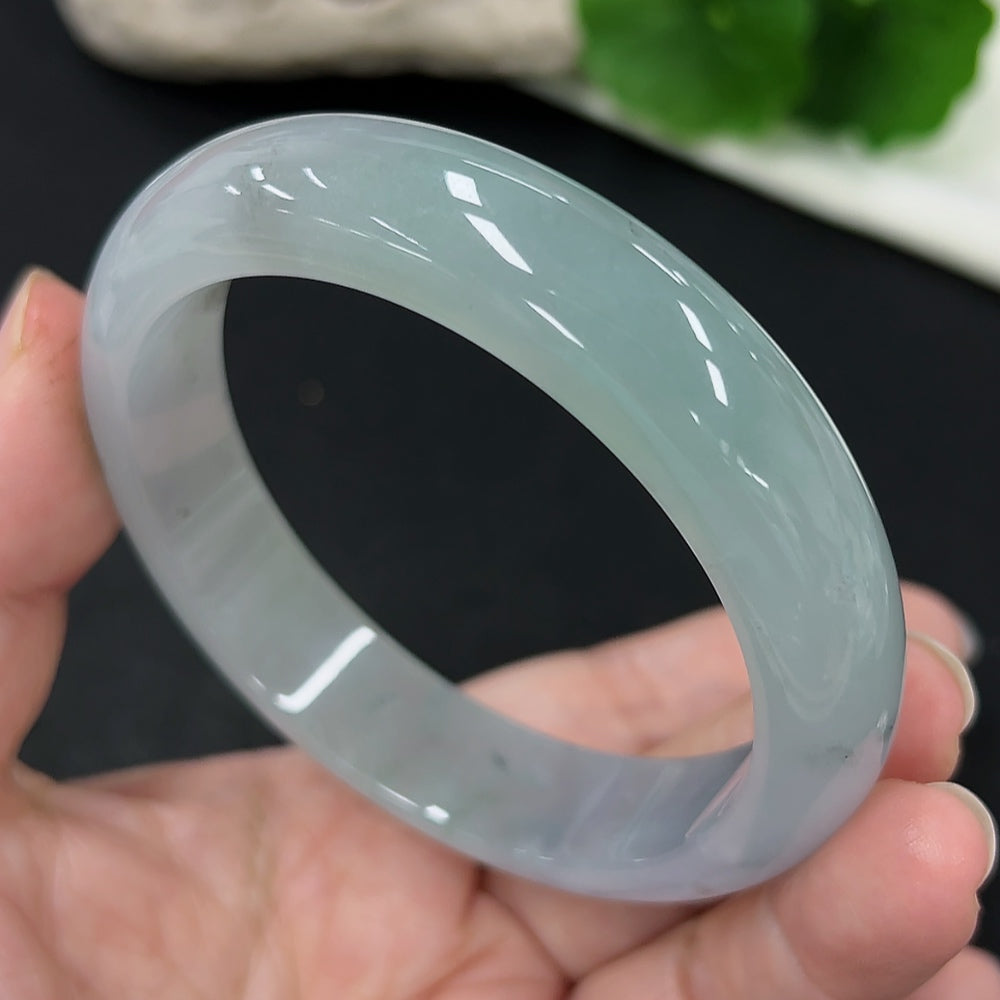 Jadeite round bangle with size 59.1 and weight approximately 65.8g, showcasing smooth, polished jade surface and classic circular shape.