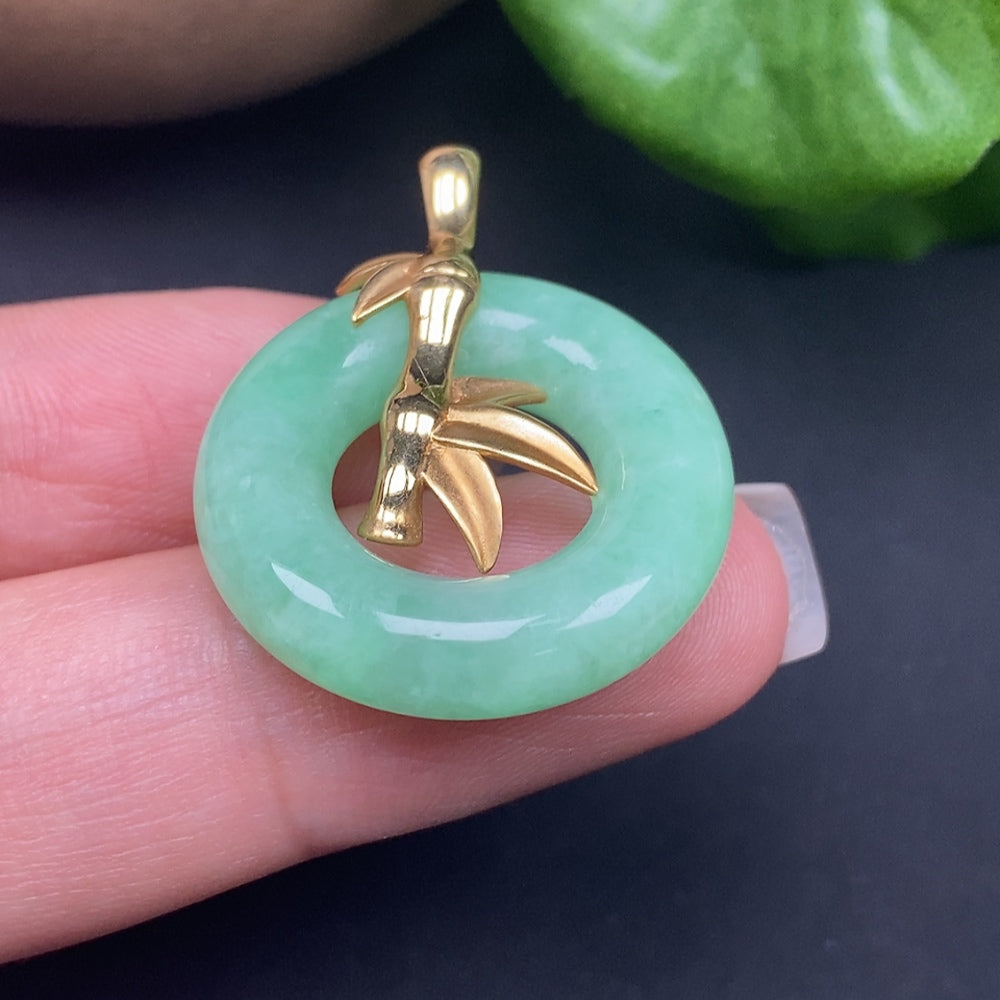 Jadeite inlaid pendant donut necklace with 18k gold, weighing approximately 9.34 grams, featuring intricate jadeite inlay design.