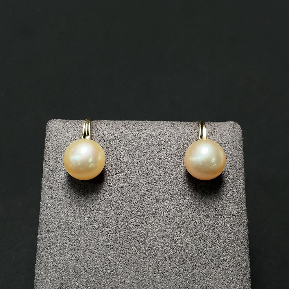 Saltwater pearl earrings with 18K gold hooks, featuring lustrous pearls and elegant design by HKHQ.