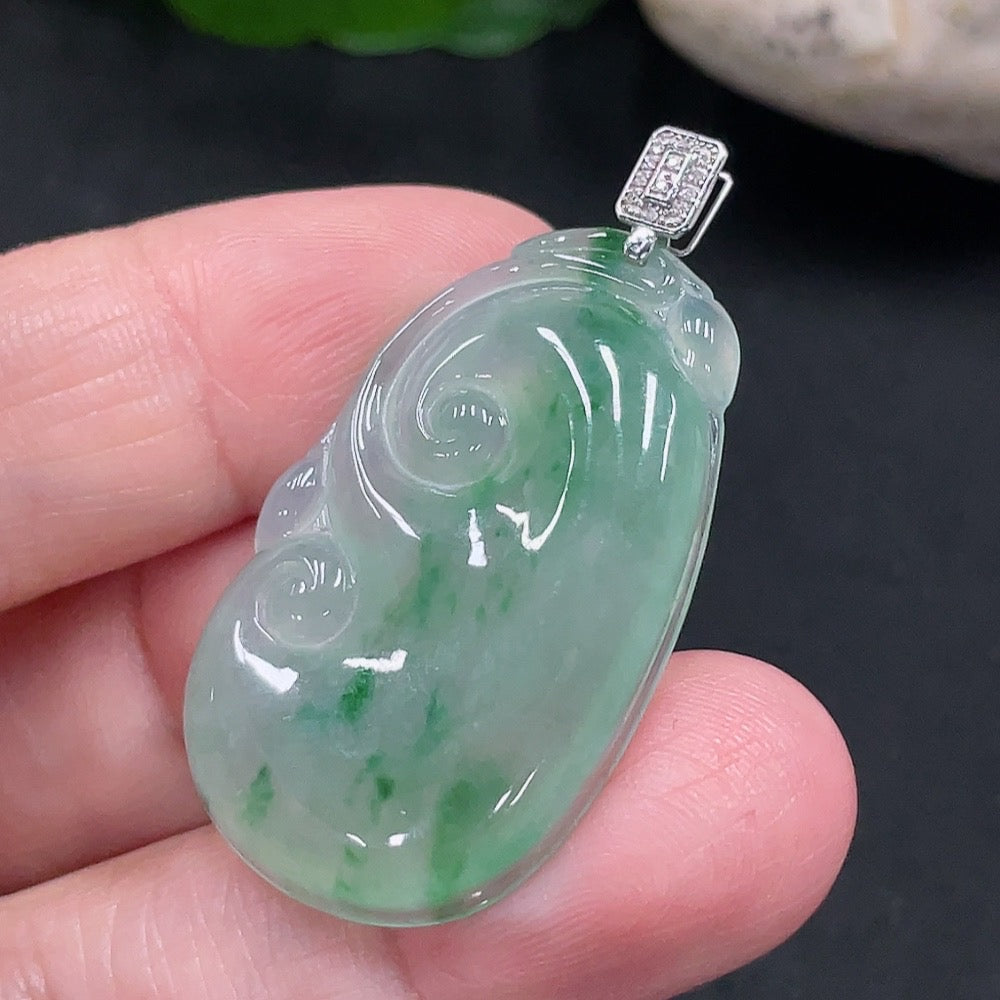 Jadeite Ruyi pendant with 18K gold and diamond accents, featuring intricate carvings and a polished finish.