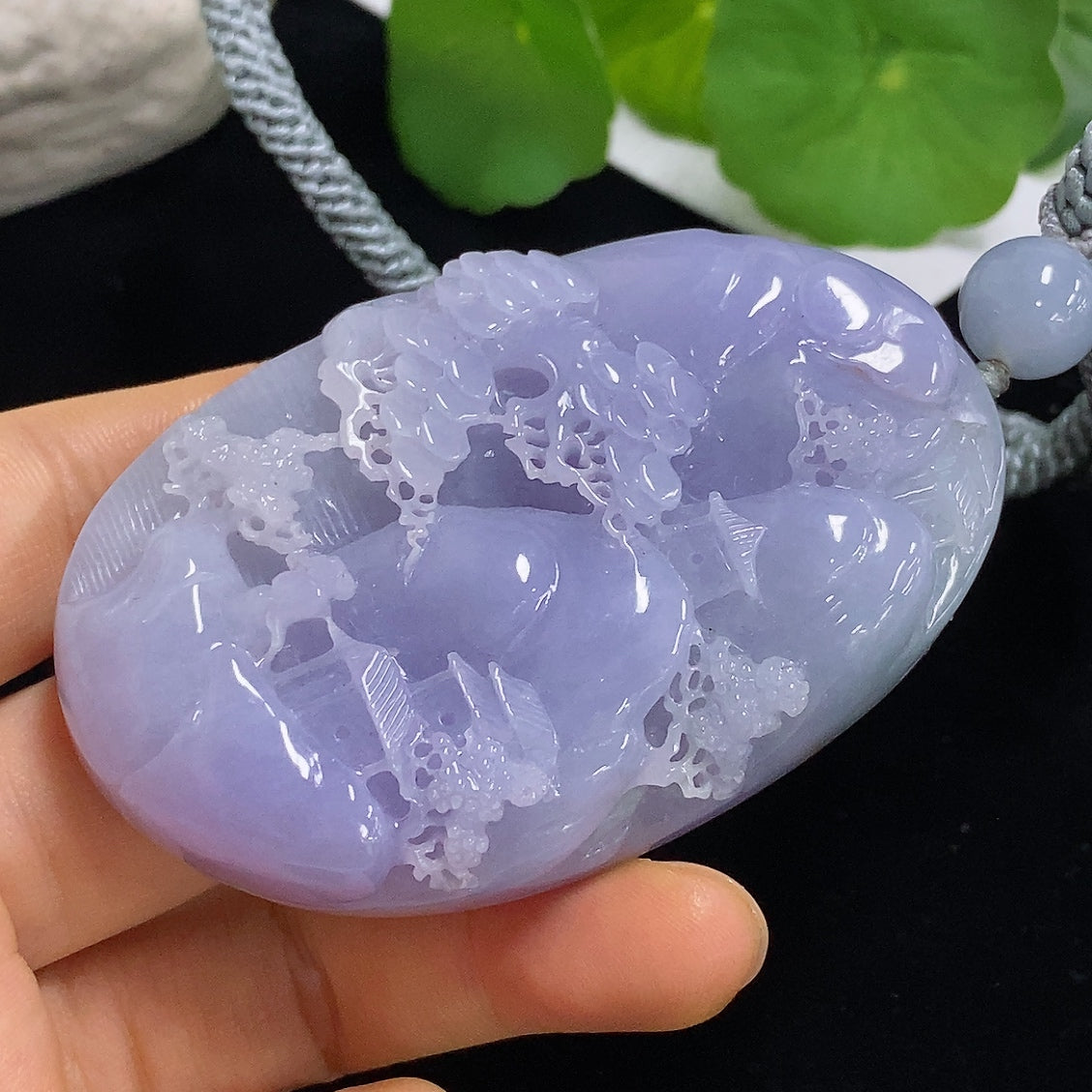 Jadeite pendant with landscape design and rope chain, weighing approximately 110.3g, crafted by HKHQ.