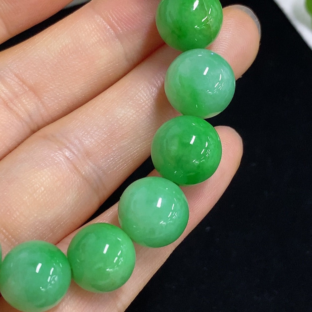 Jadeite bracelet with 11mm beads, crafted from green jade, weighing approximately 43 grams, by HKHQ.