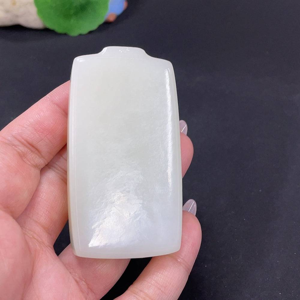 Huiliu certified Hetian jade pendant featuring a plain, polished jade stone with smooth, rounded edges and natural green hue.