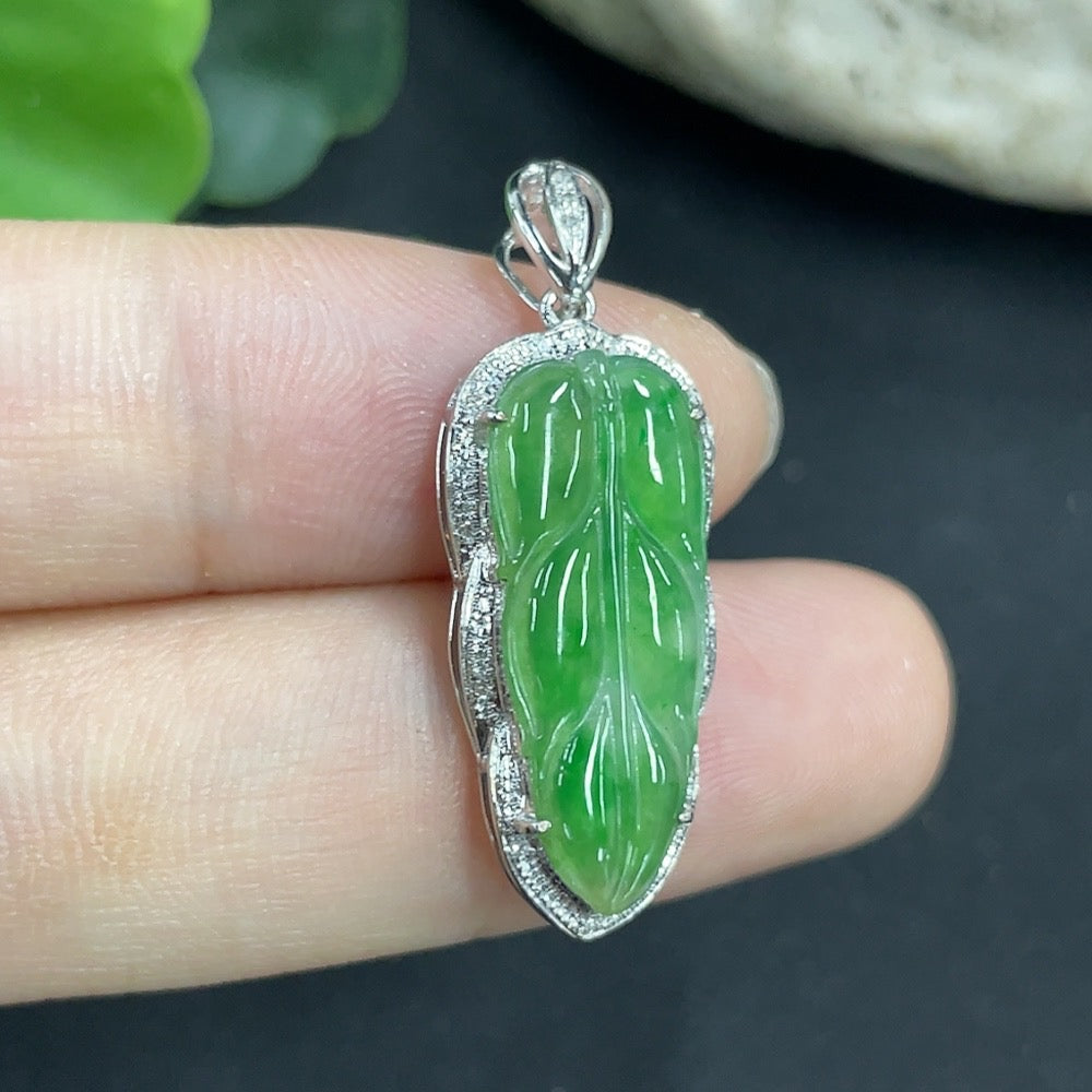 Jadeite leaf pendant necklace in 18K gold with diamond accents, elegant jewelry piece featuring detailed leaf design.