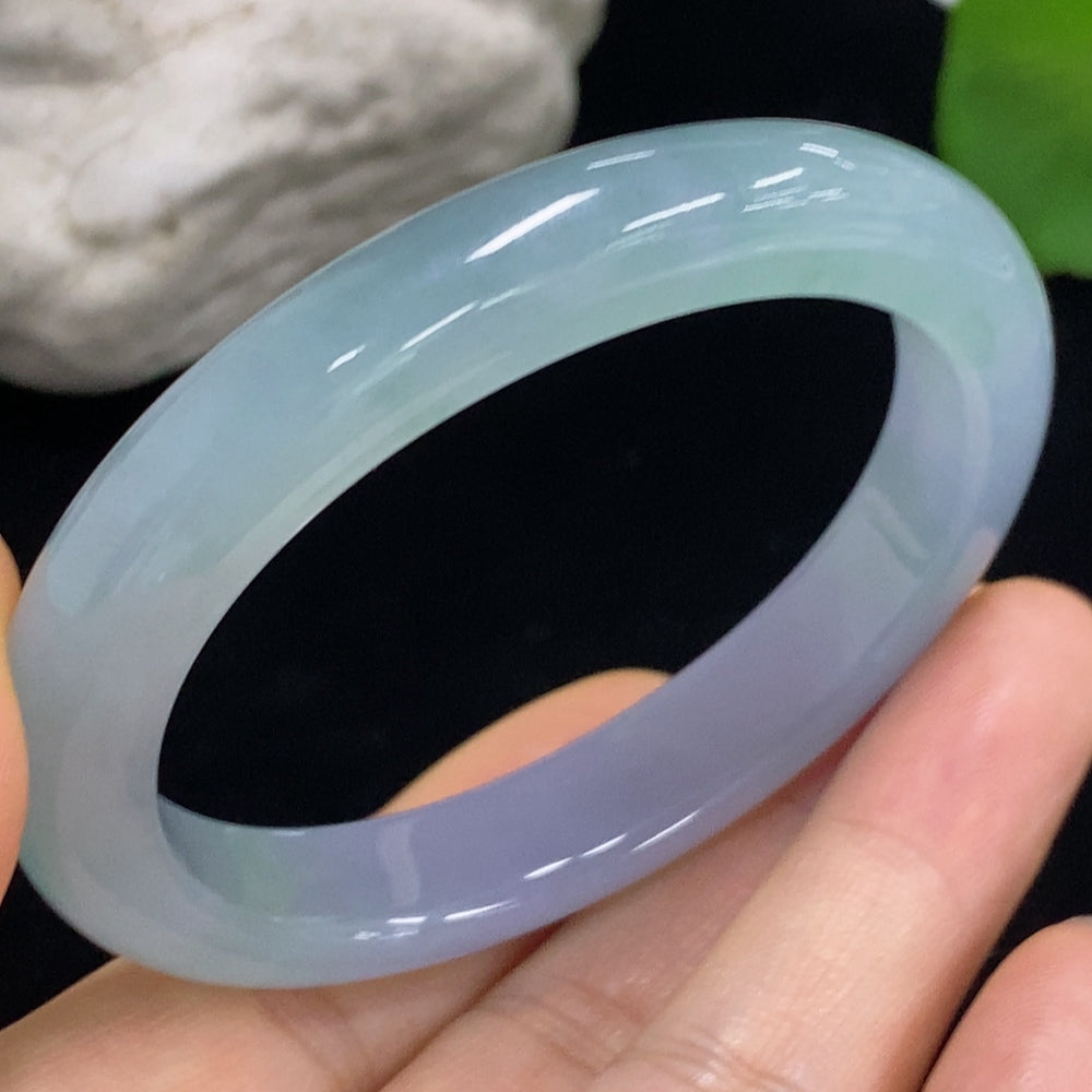 HKHQ jadeite oval bangle in size 53.2 with a weight of 38.2g, showcasing its smooth, polished surface and elegant craftsmanship.