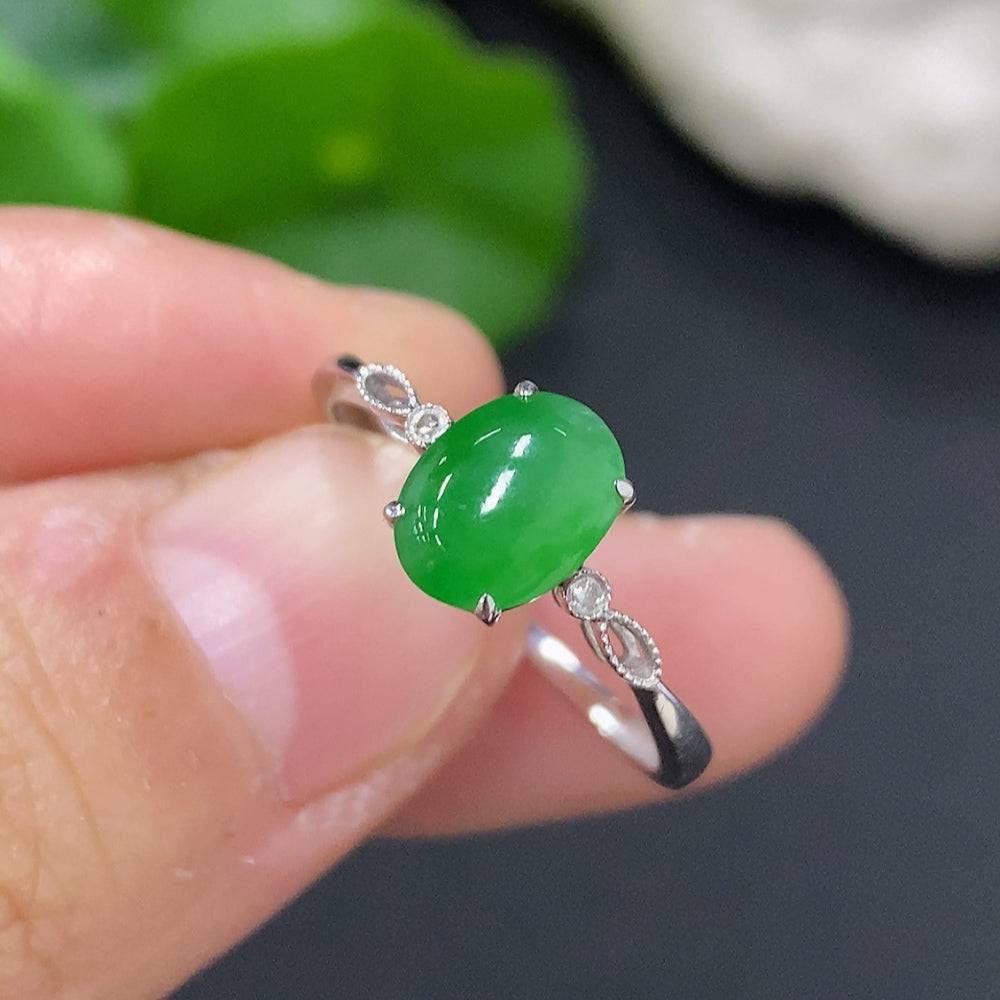 Jadeite cabochon ring with diamond accents in 18K gold, size 16, featuring a polished green jade stone and delicate gold band.