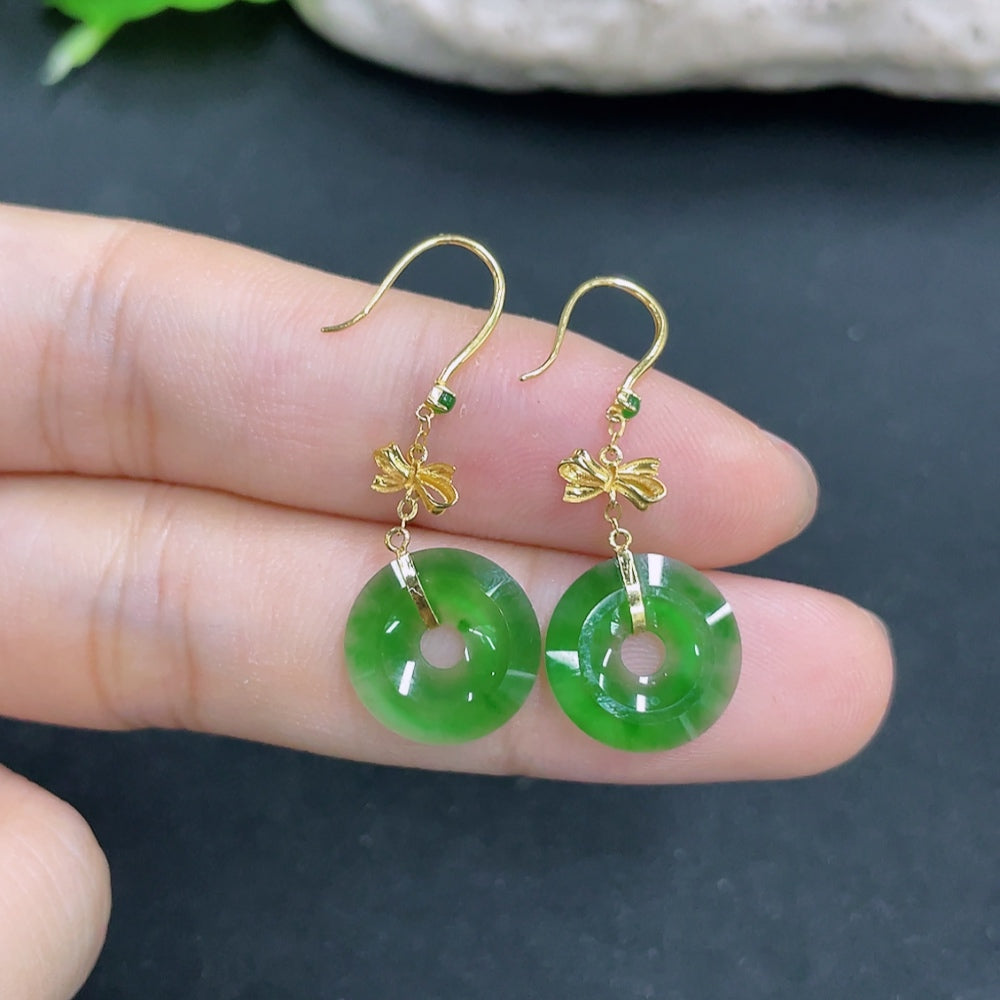 Elegant Jadeite earrings with 18k gold setting, total weight approximately 1.3g, showcasing smooth, polished jade stones.