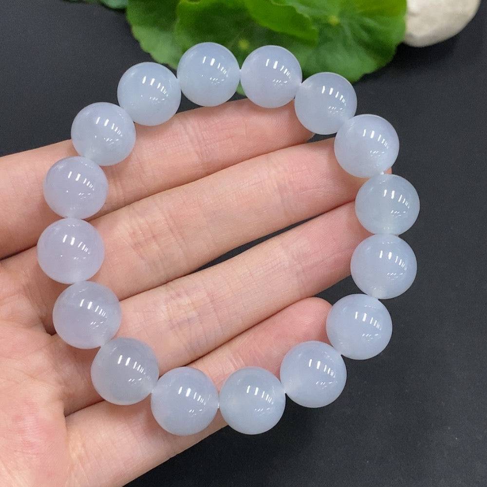 Jadeite bracelet with 12mm jade beads, total weight approximately 50.3g, featuring smooth, polished jade stones.