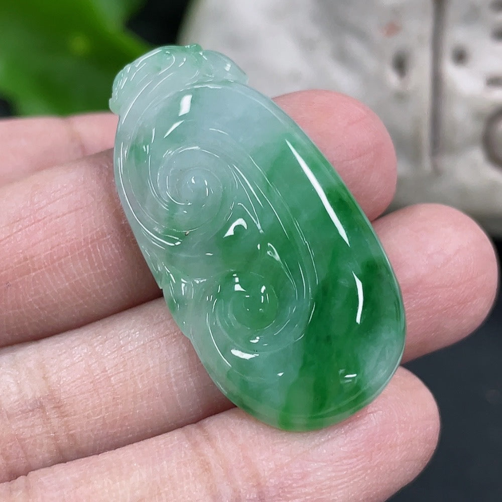 Elegant jadeite Ruyi pendant necklace by HKHQ featuring smooth, polished jadeite with intricate Ruyi design.