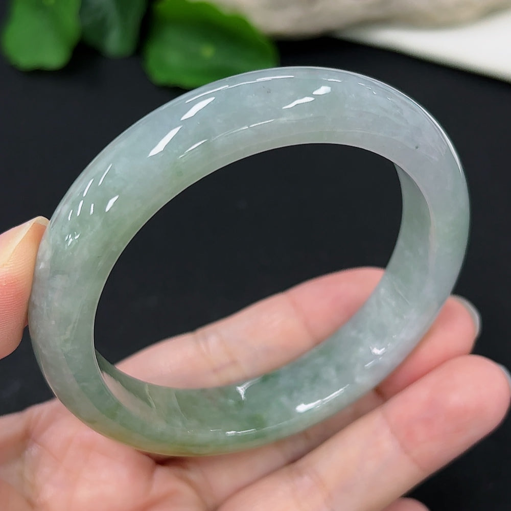 HKHQ jadeite round bangle in size 58, weighing 62.3g, featuring smooth, polished jadeite bracelet with a rounded design.
