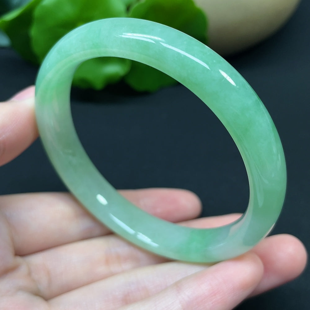 HKHQ jadeite round bangle, size 54.7, weighing 37.95g, showcasing smooth, polished green jadeite bracelet.
