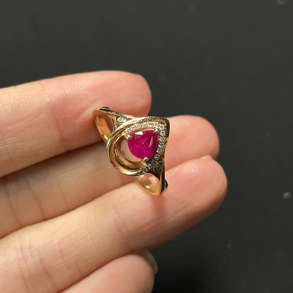 Ruby ring with diamond accents, 18K gold