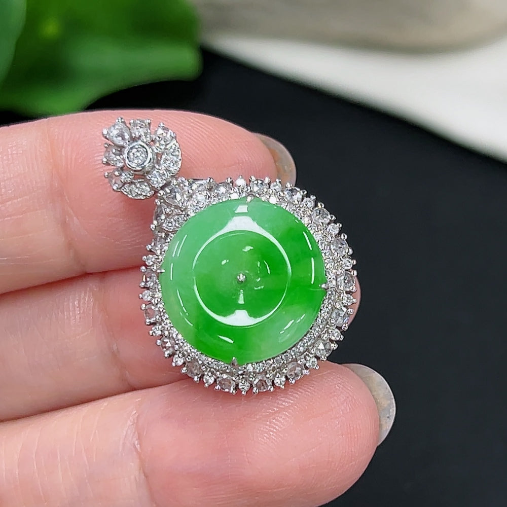 Jadeite pendant with 18K gold setting, accented with diamonds, weighing approximately 5.4 grams, from HKHQ.