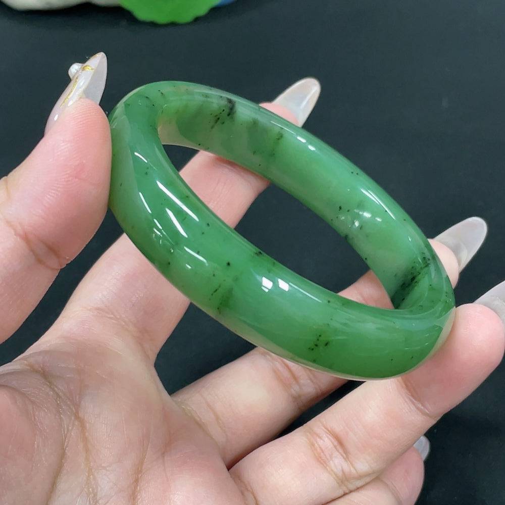 Huiliu certified Hetian jade round bracelet featuring smooth, polished jade beads on a string, showcasing elegant craftsmanship.