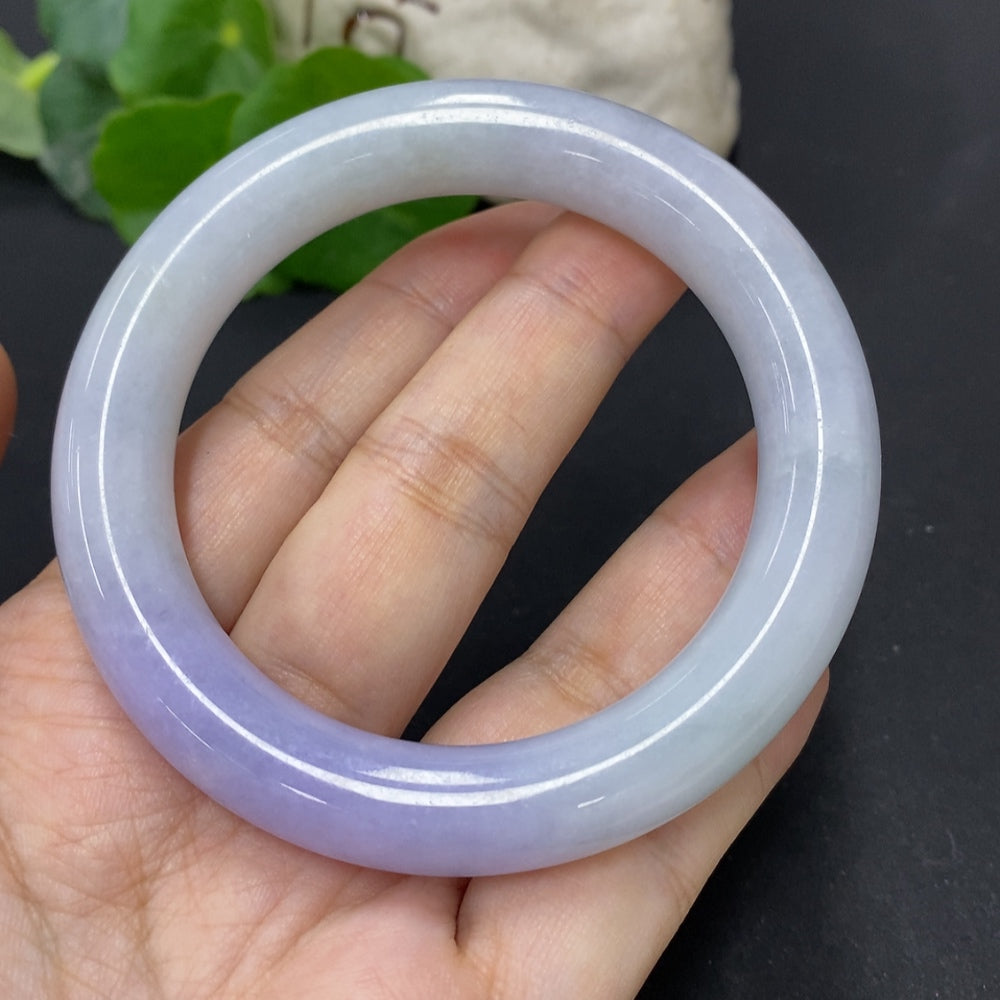 HKHQ jadeite round bangle in size 56.3 with a weight of 77.3g, showcasing smooth, polished jadeite bracelet on a neutral background.