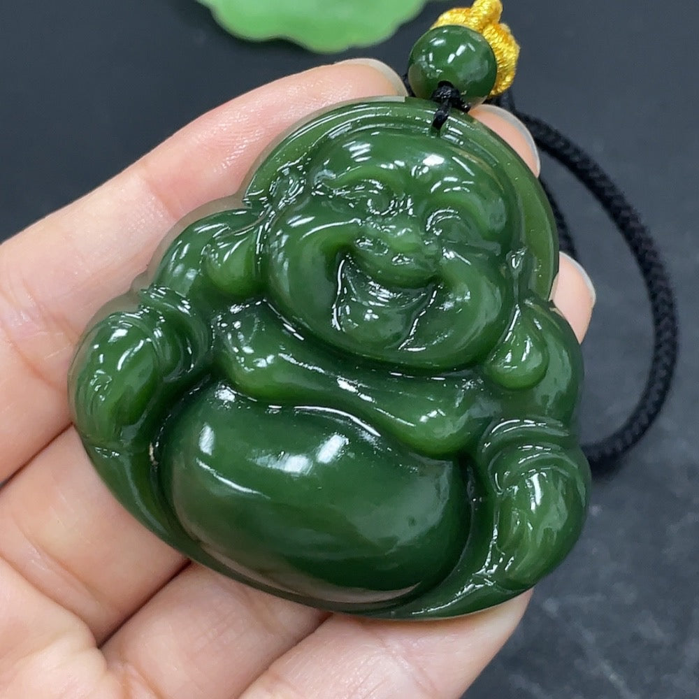 Hetian Jade Jasper Buddha pendant with rope, weighing approximately 42.2g, featuring detailed Buddha carving and natural jade color.
