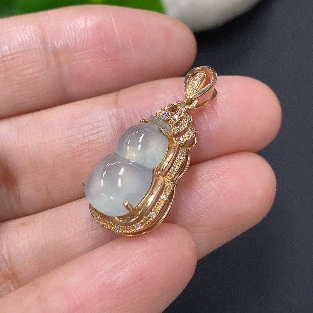 Jadeite inlaid gourd pendant with 18k gold and diamond accents, featuring a detailed jade pendant with intricate design.