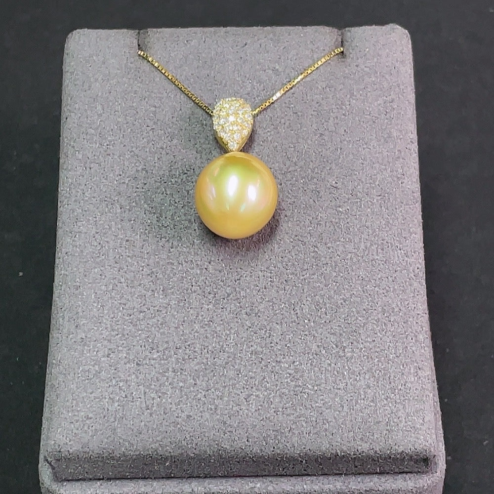 Saltwater pearl pendant necklace with 18K gold and diamond accents, showcasing elegant jewelry design and craftsmanship.