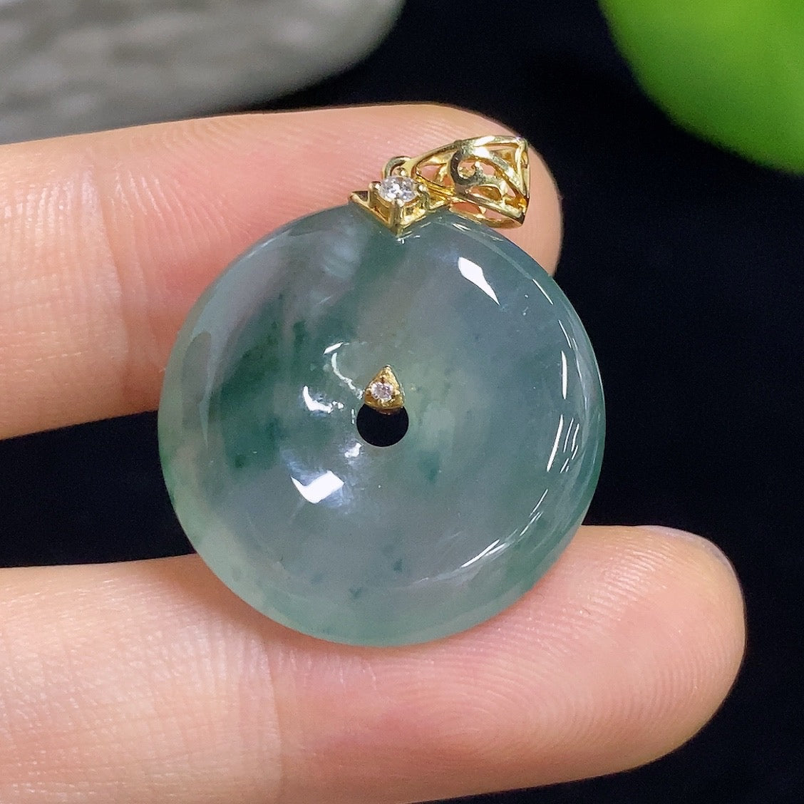 Jadeite Peace Knot pendant with 18k gold and diamond inlay, crafted by HKHQ, featuring intricate design and polished finish.