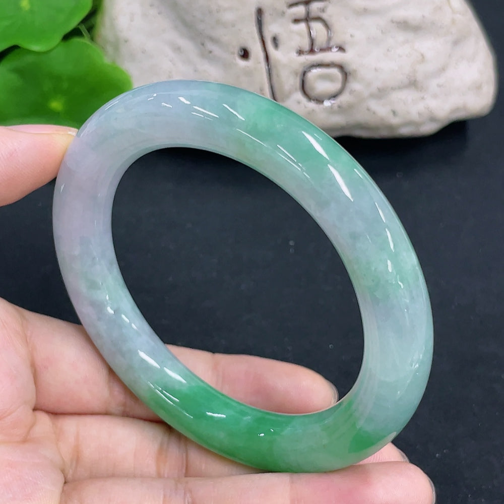 HKHQ jadeite round bangle with 64.9g weight and size 55.8, featuring smooth, polished jade surface and elegant circular design.