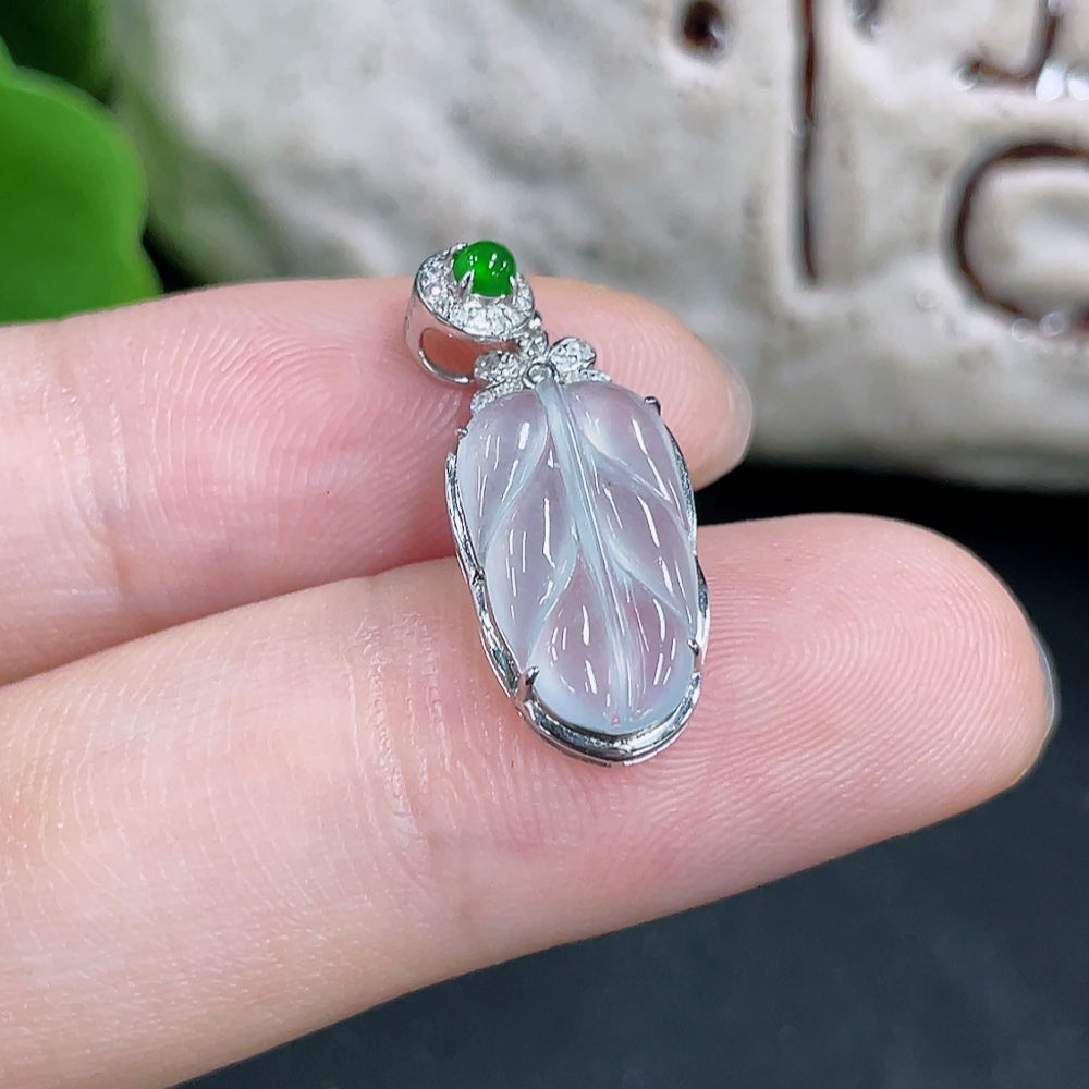 Jadeite pendant with 18k gold setting and diamond accents, crafted by HKHQ, featuring a smooth green jade gemstone.