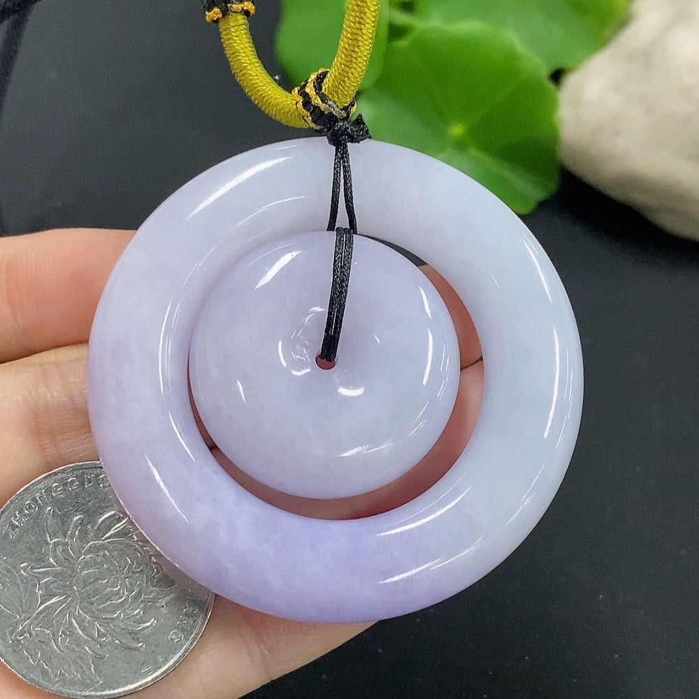 Jadeite mother-and-child toggle pendant with detailed carvings, weighing approximately 55.29g, crafted by HKHQ.