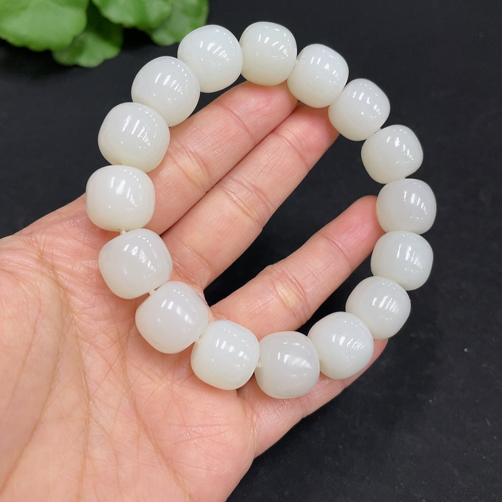 Huiliu certified Hetian jade bracelet with 13.8mm smooth round beads, showcasing its rich green color and polished finish.