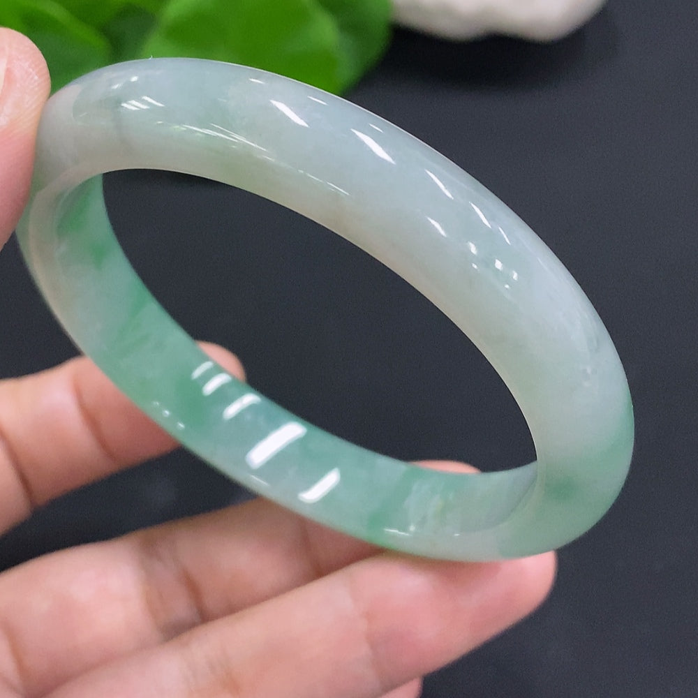 HUILIU HQ jadeite round bangle in size 55.6 with a total weight of 42.3g, showcasing smooth, polished jade surface.