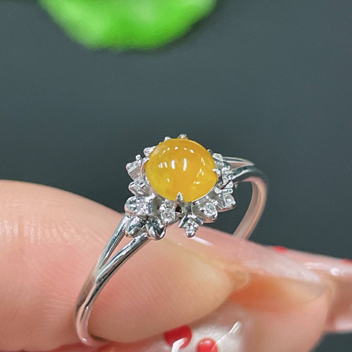 Huiliu certified jadeite ring set with sparkling diamonds, featuring intricate designs on polished jadeite rings.
