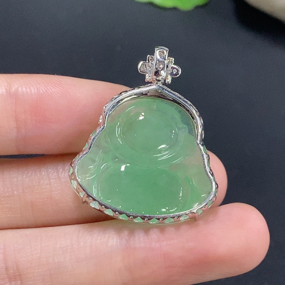 Jadeite Buddha pendant necklace with 18k gold and diamond accents, displayed on a neutral background.