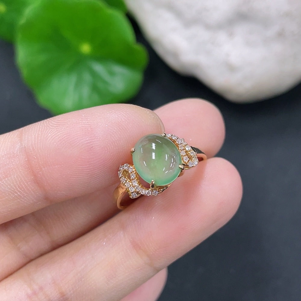 Elegant jadeite inlaid ring with 18K gold and diamond accents, showcasing intricate craftsmanship and luxurious design.