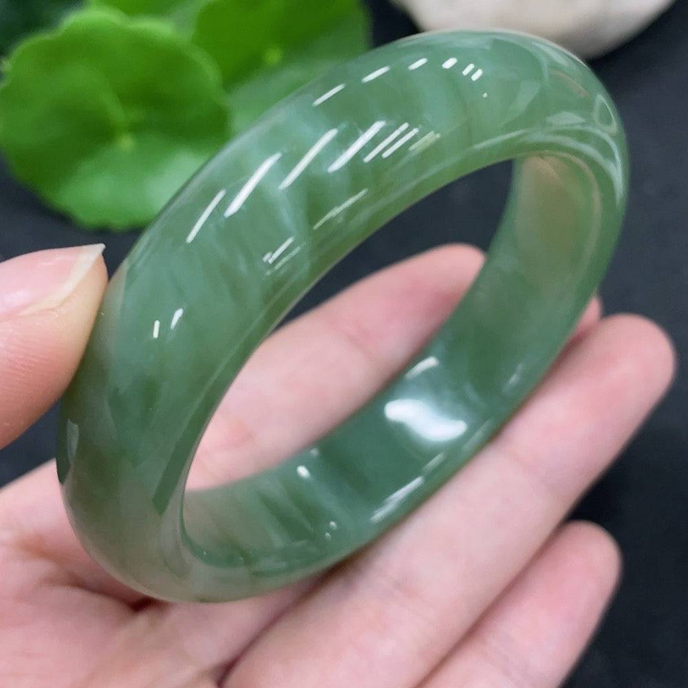 Huiliu certified Hetian jade round bracelet with smooth, polished jade beads showcasing natural green hues and craftsmanship.