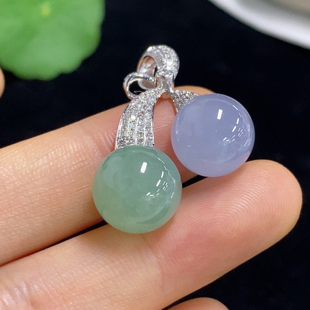 Jadeite bead inlaid pendant by HUILIU HQ with 18k gold accents and diamond details, featuring a smooth, polished jade gemstone.
