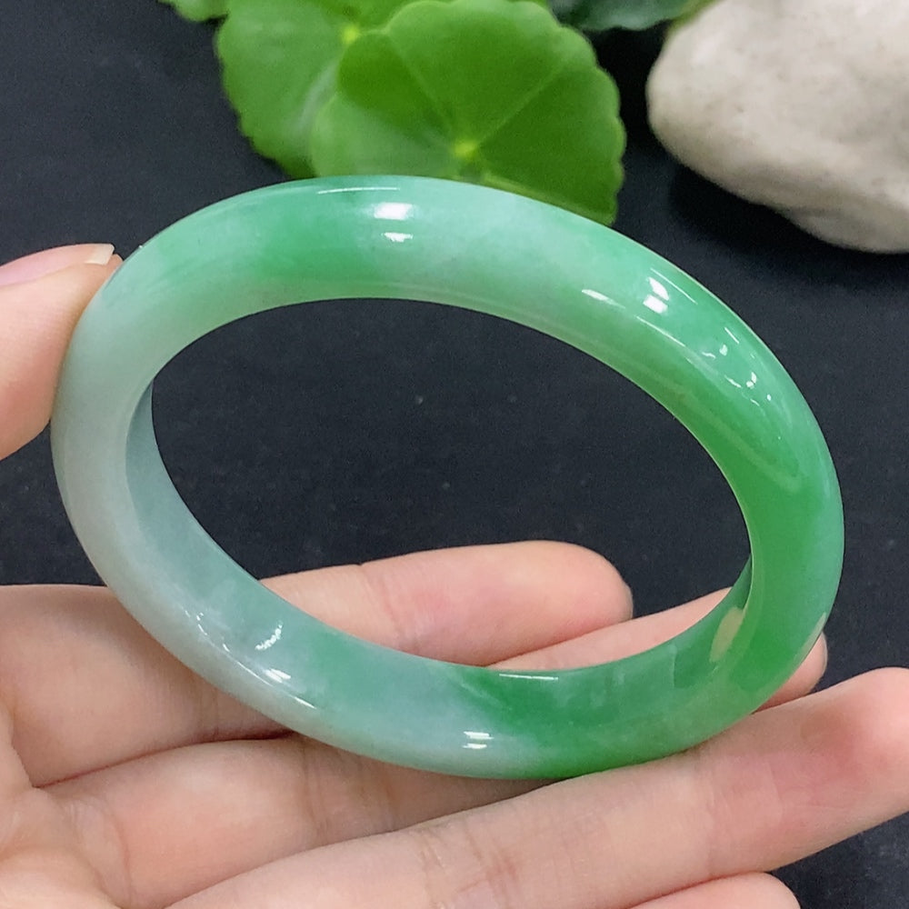 HKHQ jadeite oval bangle in size 53.5, weighing 38.88g, featuring a smooth, polished jadeite bracelet with elegant oval shape.