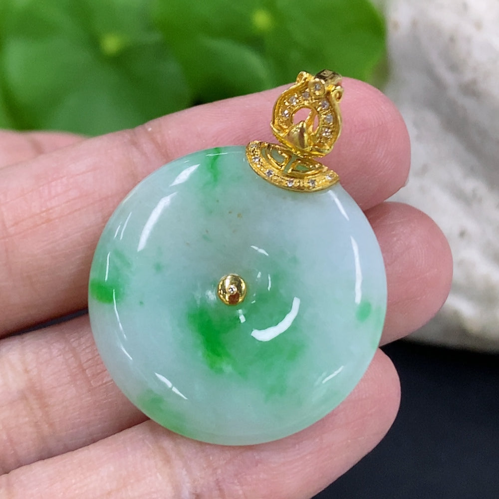 Jadeite Peace Knot pendant with 18K gold clasp and diamond accents, showcasing intricate jade craftsmanship and elegant design.