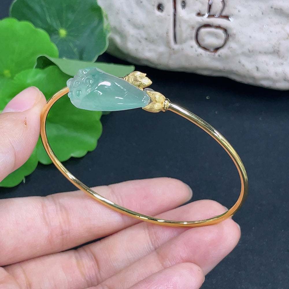 Elegant jadeite inlaid bracelet featuring 18K gold from HKHQ, showcasing intricate craftsmanship and vibrant green jade details.