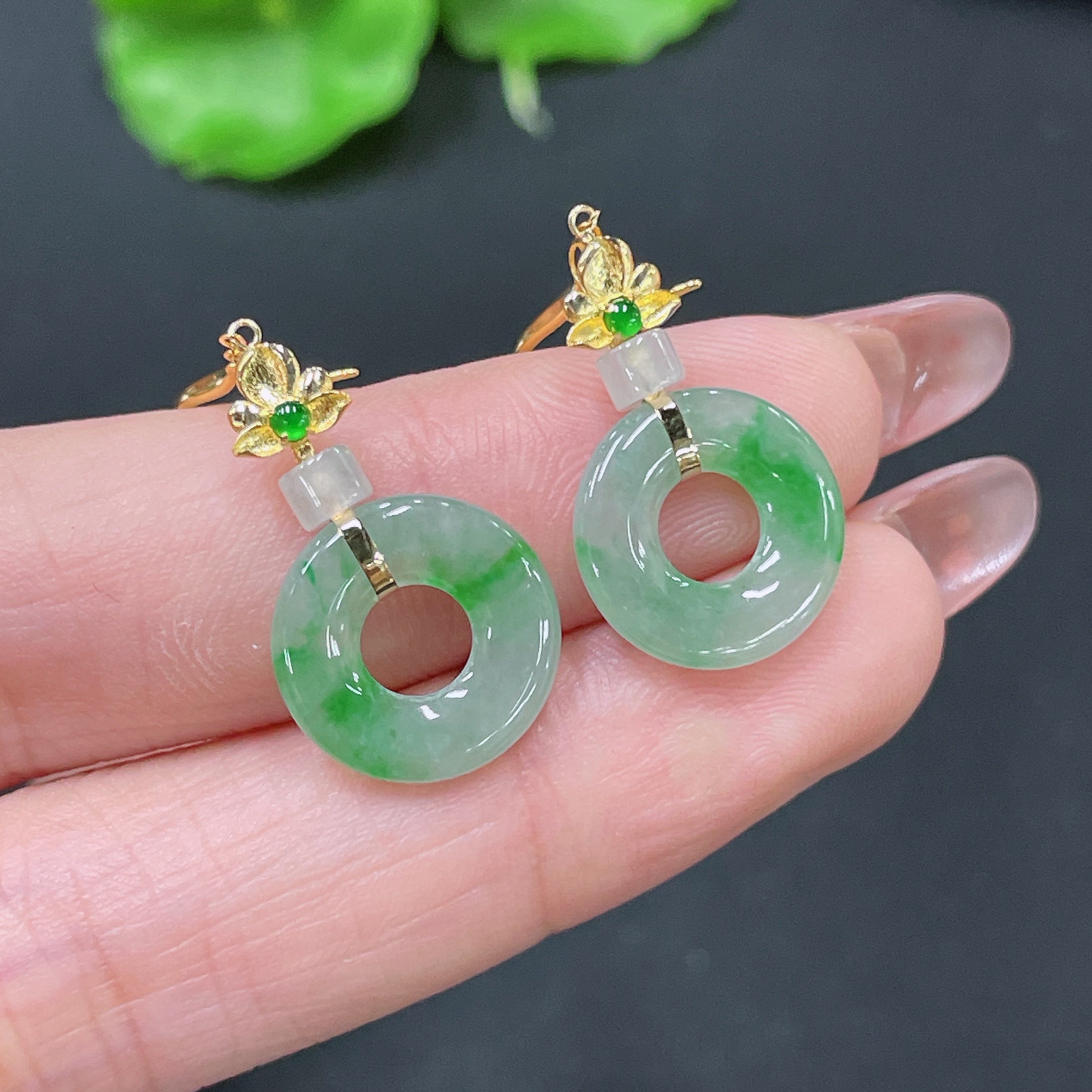 Huiliu certified jadeite earrings featuring polished green jade stones, elegant and handcrafted jewelry by HUILIU HQ.
