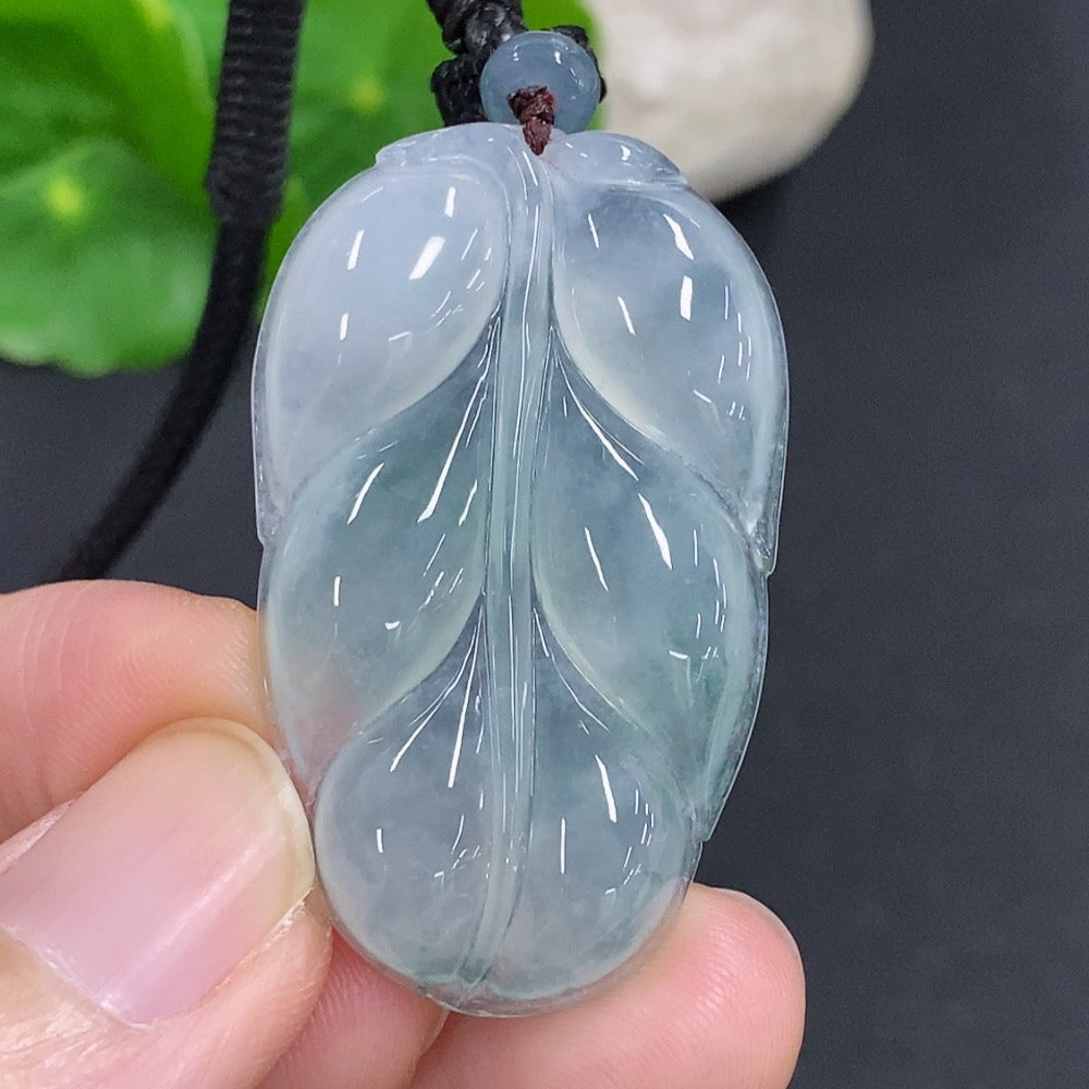 HKHQ jadeite leaf pendant necklace featuring a polished green jade leaf charm on a delicate chain.