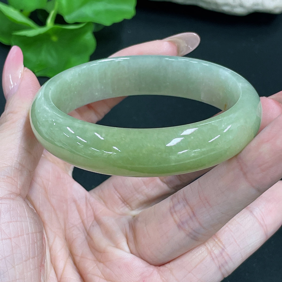 HKHQ jadeite round bracelet weighing 51.42g, size 56.8, featuring smooth, polished green jade beads on a delicate string.