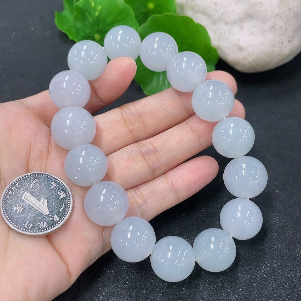 HKHQ jadeite bracelet featuring 15.4mm smooth, polished jadeite beads, elegant jewelry accessory for everyday or special occasions.