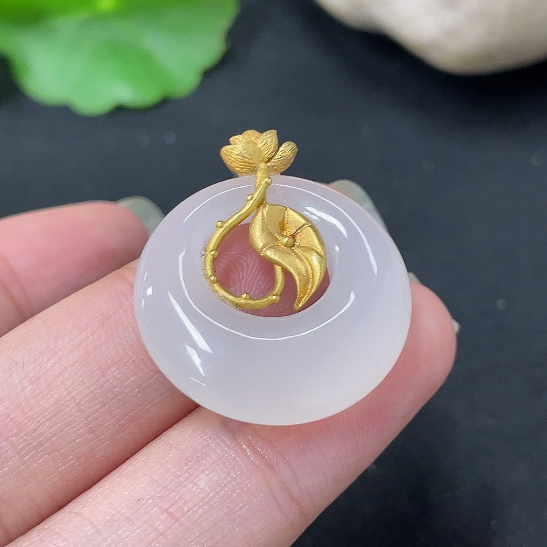 Hetian jade inlaid pendant necklace with 18K gold setting, HKHQ brand, showcasing a detailed jade design on a chain.
