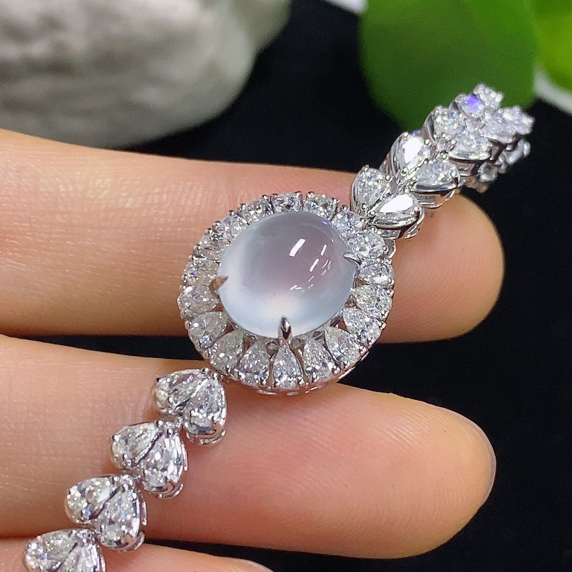 Jadeite cabochon bracelet in 18K gold with diamond accents, showcasing a luxurious jewelry piece from HKHQ.
