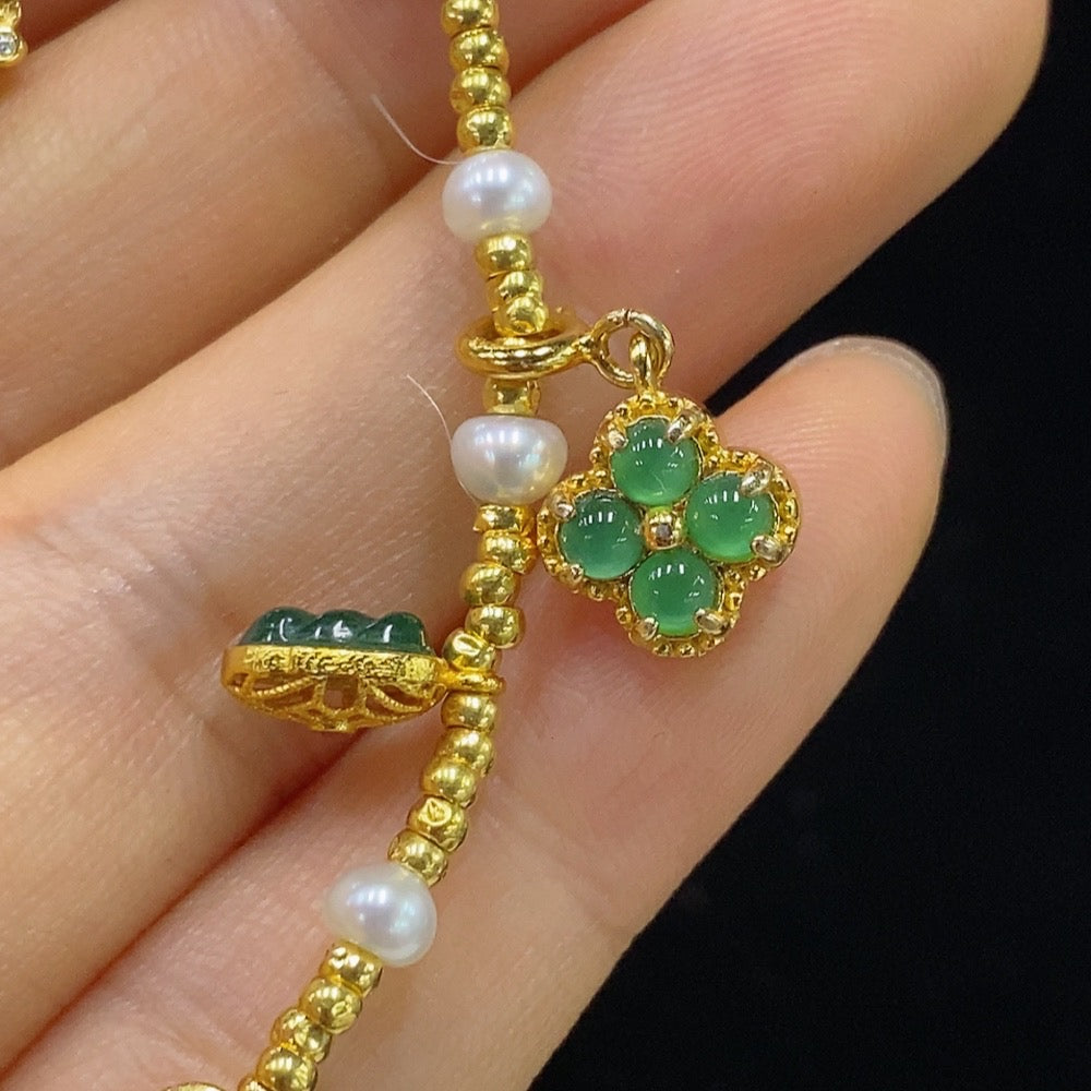 HUILIU HQ jadeite inlaid bracelet with red beads, gold tested non-gold small beads, yellow accents, and intricate design.