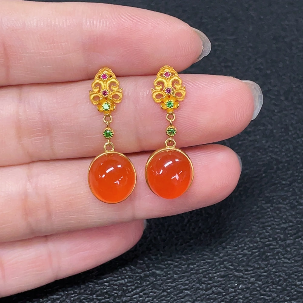 Red Agate gemstone earrings with 18K gold settings, featuring non-natural accent stones and a total weight of 2.95 grams.