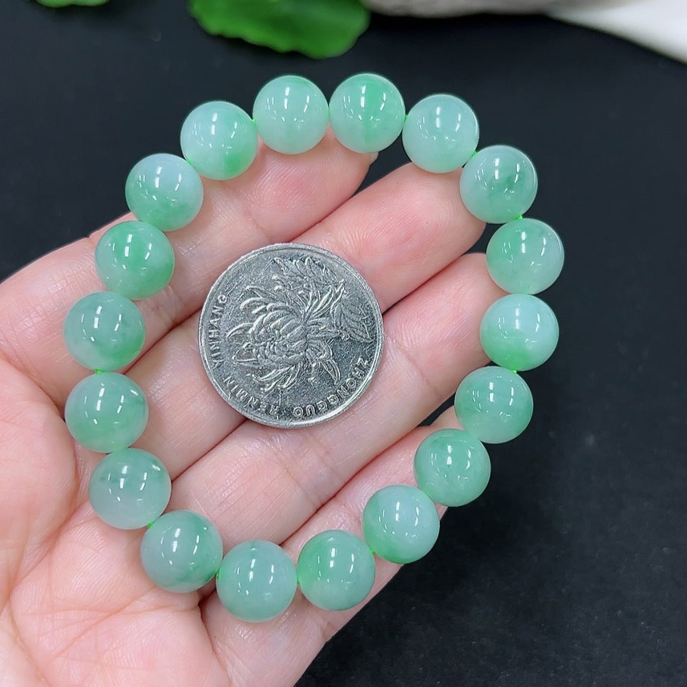 Elegant jadeite bracelet featuring smooth, polished jade stones, crafted by HKHQ for a stylish, natural look.