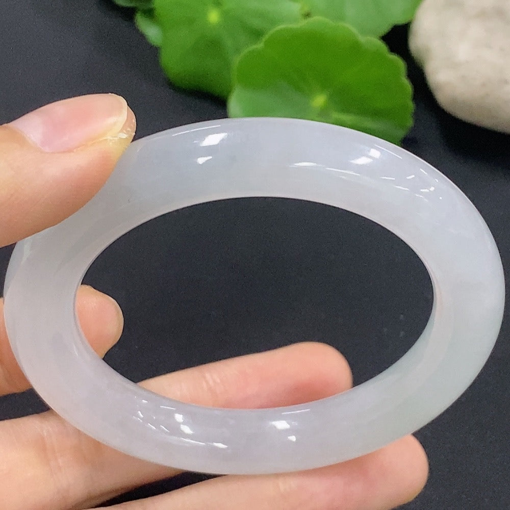 Jadeite round bangle with a size of 50.2, weighing approximately 50.18g, displayed on a neutral background.