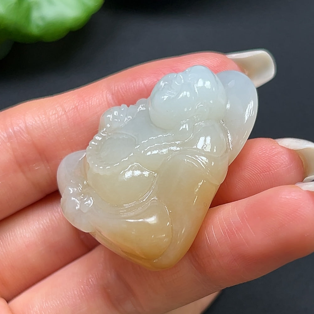 Hetian jade Buddha pendant necklace by HKHQ featuring a smooth, polished jade Buddha charm on a delicate chain.